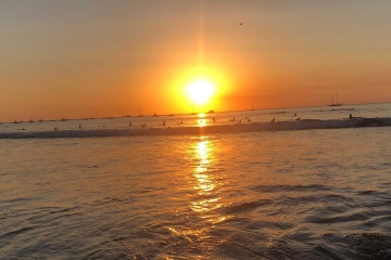 Sunset-surfers-awaiting-the-waves