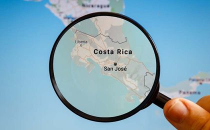 global map with magnifying glass on top of Costa Rica