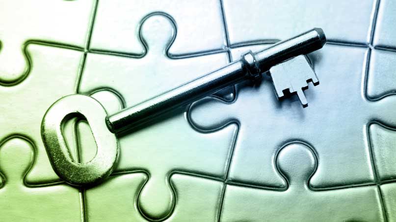 key resting on top of a jigsaw puzzle