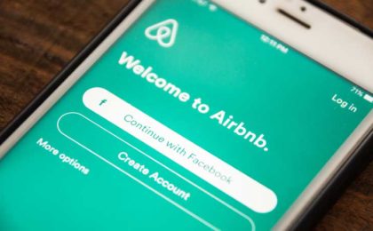 smart phone that says welcome to airbnb