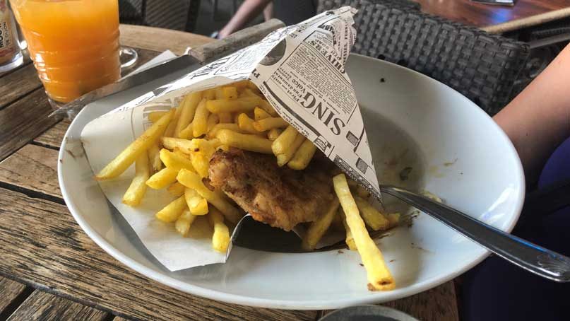 fish and chips wrapped in newspaper