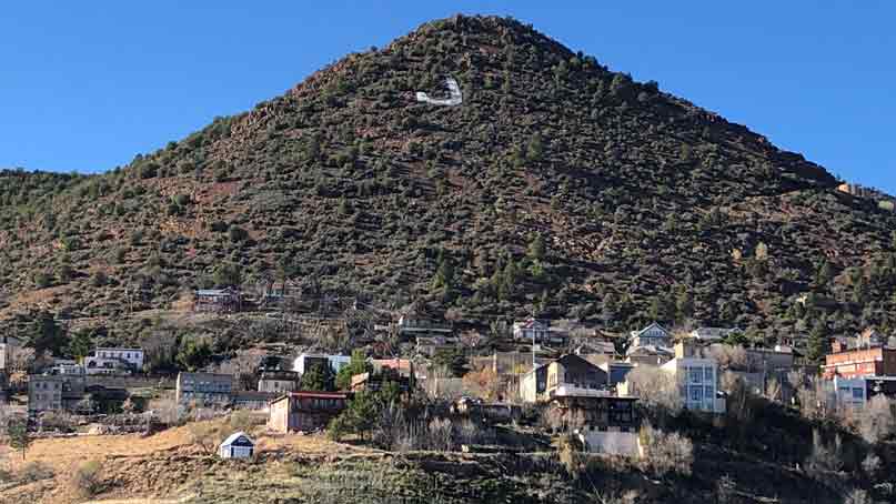landscape view of mountain and houses in foreground