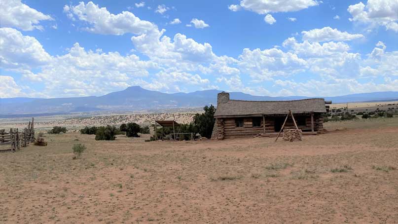 old run down house alone in a desert landscape