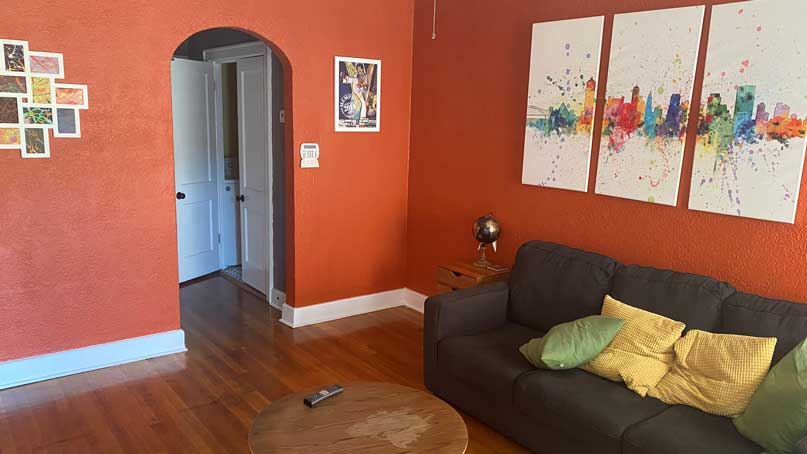 living room with orange painted walls