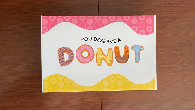 donut box that says 'you deserve a donut'
