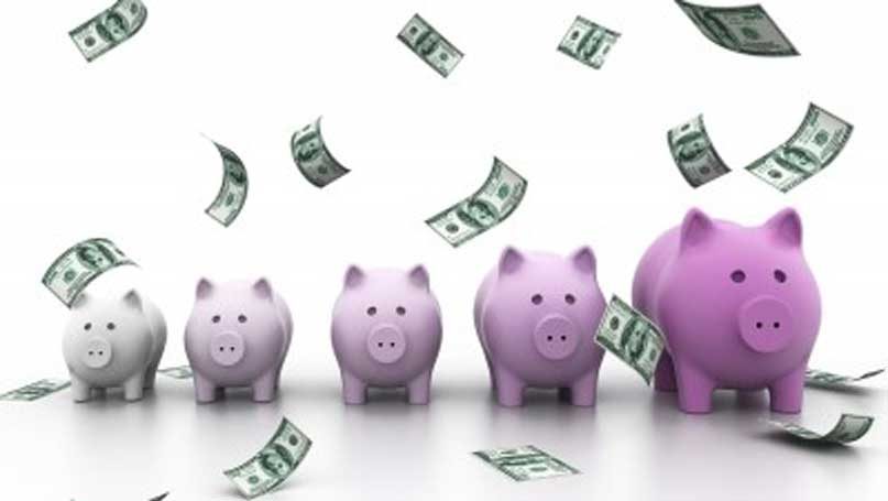 five piggy banks with money falling from above