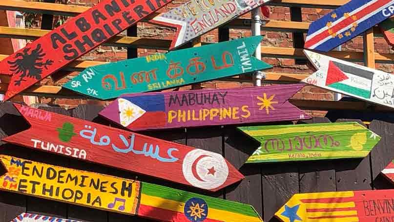 welcome signs in various languages including from Philippines