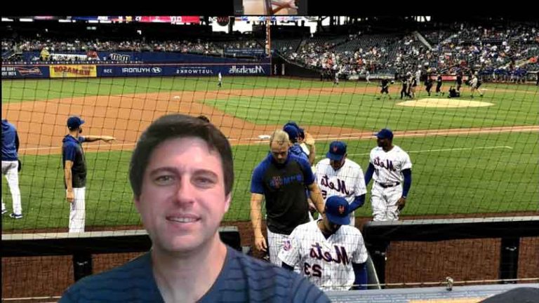 man in front of a virtual background of a baseball stadium